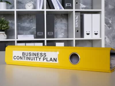 business continuity plan, yellow binder that has a comprehensive disaster recovery plan